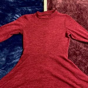 Brunette dress and it is from decree. Also very warm with medium length sleeves.